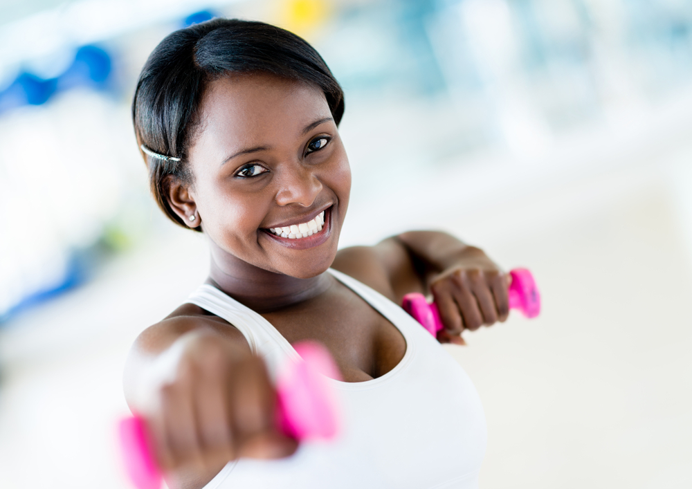Strong woman weightlifting at the gym working out