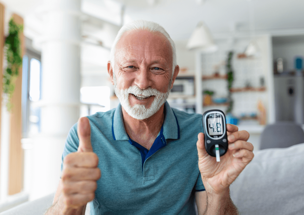 healthy happy older man blood sugar reading (1)